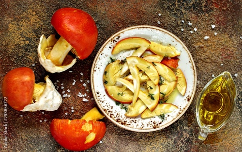 salad or carpaccio of raw mushrooms Amanita Caesarea . a family of fly-agarics of the highest category, a delicious mushroom. Italian Cuisine. raw food diet photo