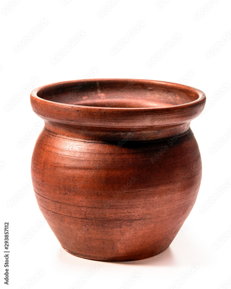 Empty clay pot on a white isolated background close-up.
