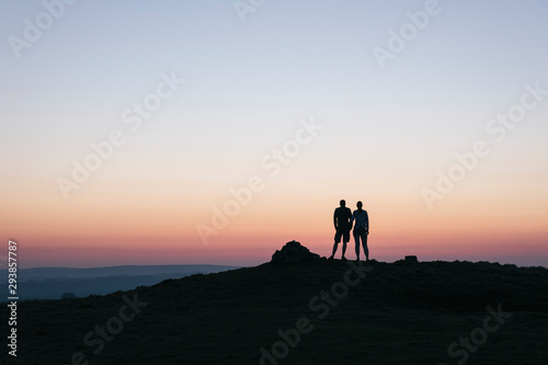 Couple admiring the view at twilight from Little Longstone, Derb photo