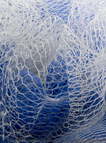 Closeup stack shot of blue and white plastic mesh patterns.