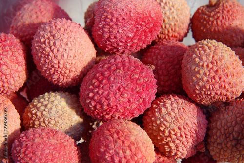 Fresh red lychee fruits background. 