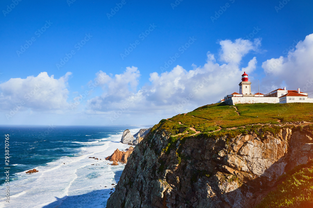 Cabo da Roca, Portugal. Lighthouse and cliffs over Atlantic Ocean, the most westerly point of the European mainland. Cabo da Roca, Portugal. Lighthouse and cliffs over Atlantic Ocean, the most westerly point of the European mainland.