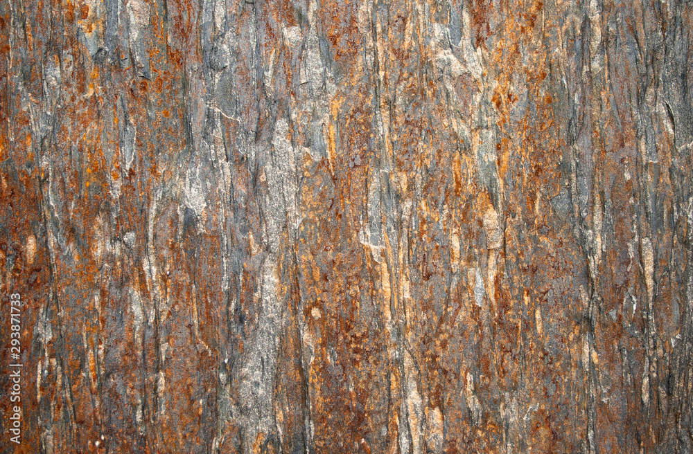 Abstract background of the surface of a stone called Portuguese with iron ore strokes making surreal shapes