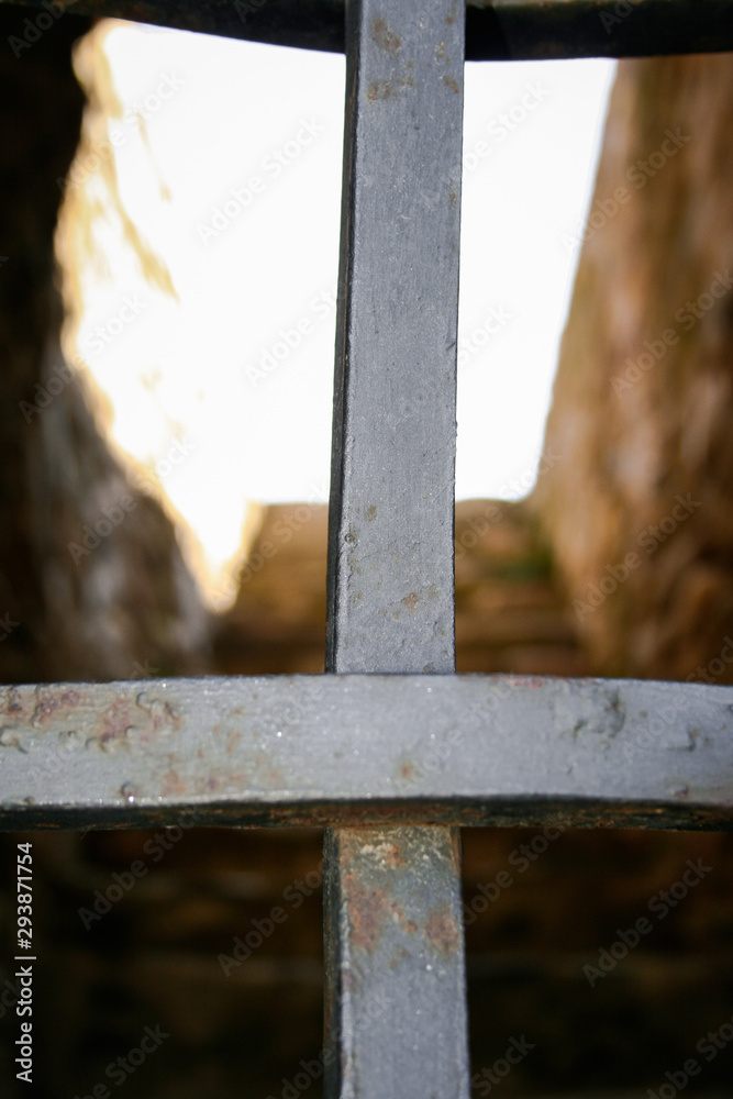 Beautiful metal gate gate closing access to an old stone building Beautiful metal gate gate closing access to an old stone building