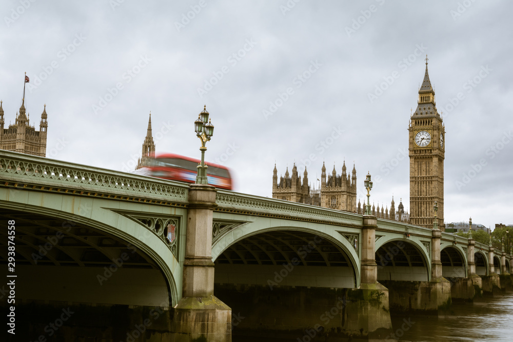 Motion blur of a red double decker bus while crossing the Westminster Bridge in London