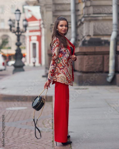 Woman in colorful red suit photo