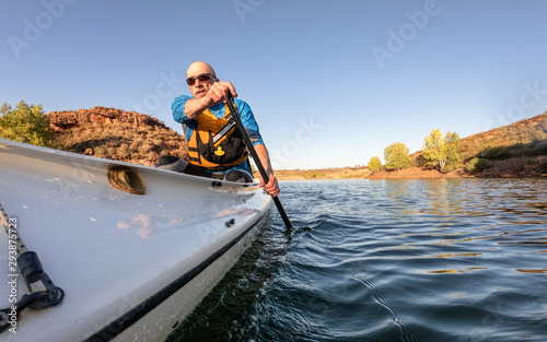 paddling expedition canoe on lake POV