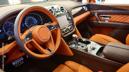 Brown leather interior of a luxury car © sarymsakov.com