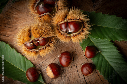 Sweet Chestnuts - Castanea sativa on an old wooden table