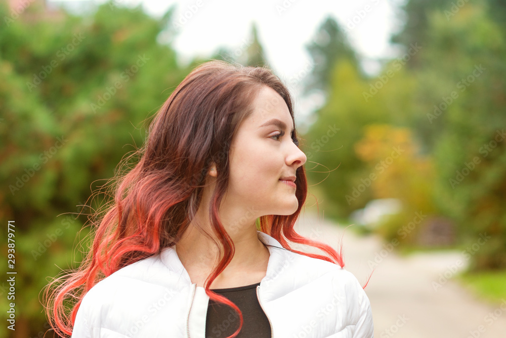 Portrait of a young beautiful girl with long hair in nature in autumn. Lifestyle. Portrait of a young beautiful girl with long hair in nature in autumn. Lifestyle.