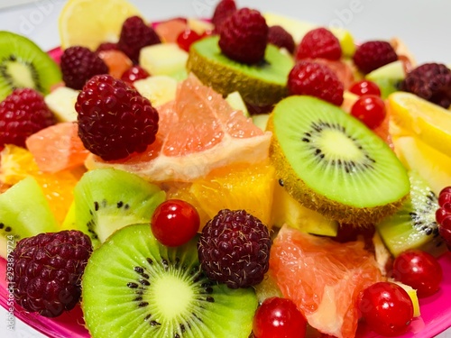 Fototapeta Naklejka Na Ścianę i Meble -  Bright colored sliced fruits.