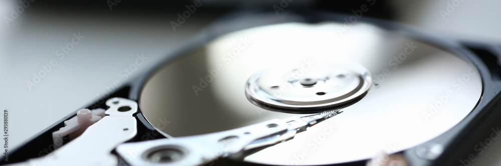 Hard drive from computer or laptop lies on the table in the repair shop. Performs fault diagnostics and performs urgent repairs recovery of lost data during deletion HDD closeup Hard drive from computer or laptop lies on the table in the repair shop. Performs fault diagnostics and performs urgent repairs recovery of lost data during deletion HDD closeup