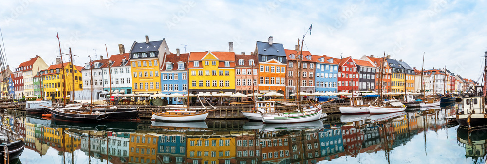 magical fascinating landscape with boats in a famous Nyhavn in the capital of Denmark Copenhagen. Exotic amazing places. Popular tourist atraction.