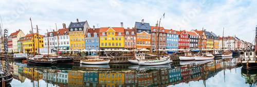 Obraz na płótnie magical fascinating landscape with boats in a famous Nyhavn in the capital of Denmark Copenhagen. Exotic amazing places. Popular tourist atraction. w salonie