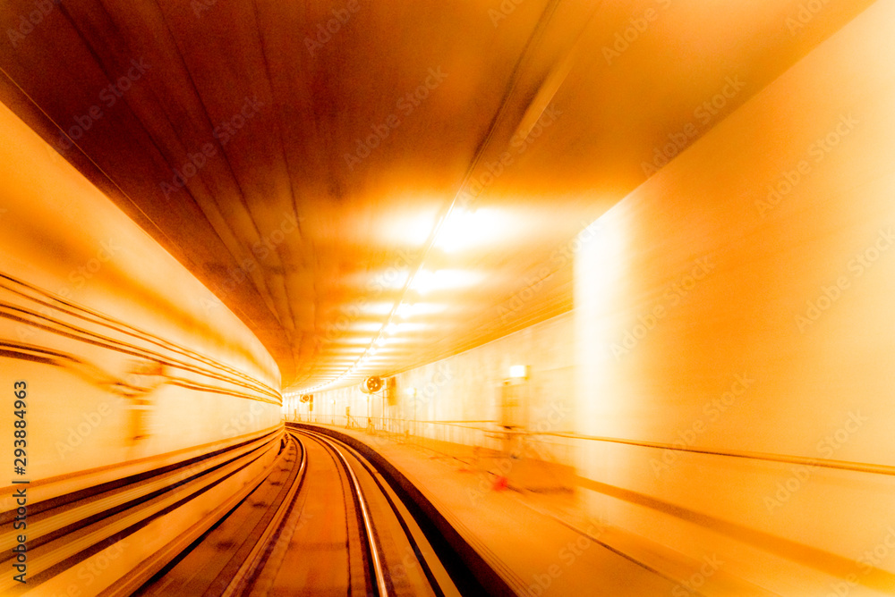 Abstract image of motion blurred tracks and subway tunnel in Copenhagen, Denmark.