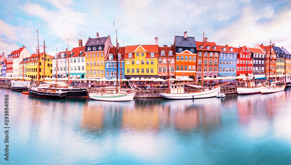 Unmatched magical fascinating landscape with boats in a famous Nyhavn in the capital of Denmark Copenhagen. Exotic amazing places. Popular tourist atraction.