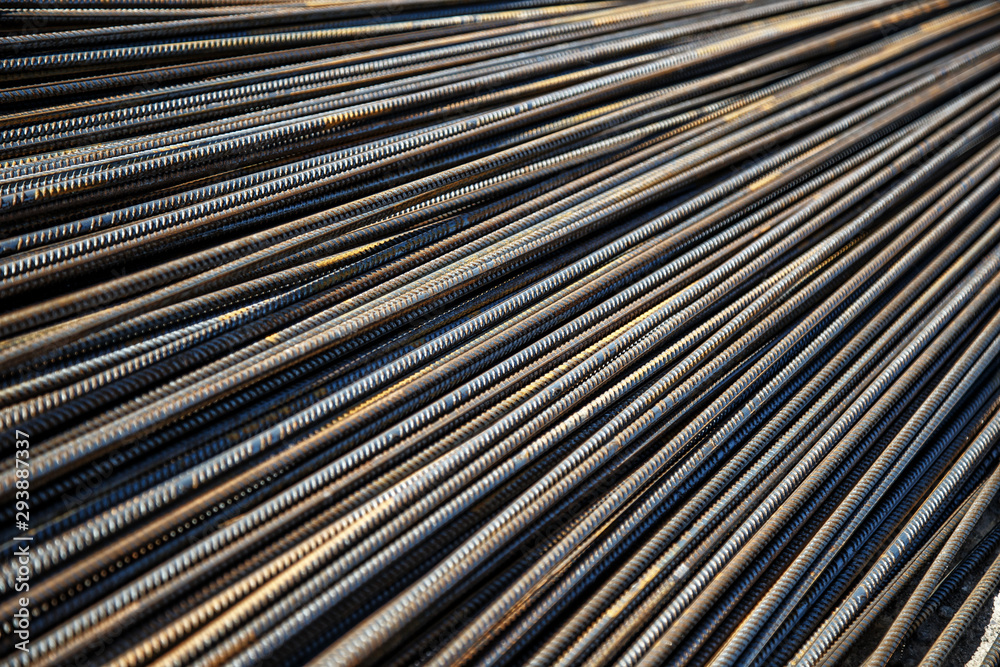 Obraz premium Industrial background. Preparation for pouring concrete. Construction of buildings of reinforced concrete.steel reinforcement bar texture in construction site,Closeup of Steel rebars