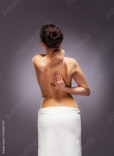 Woman massaging back pain