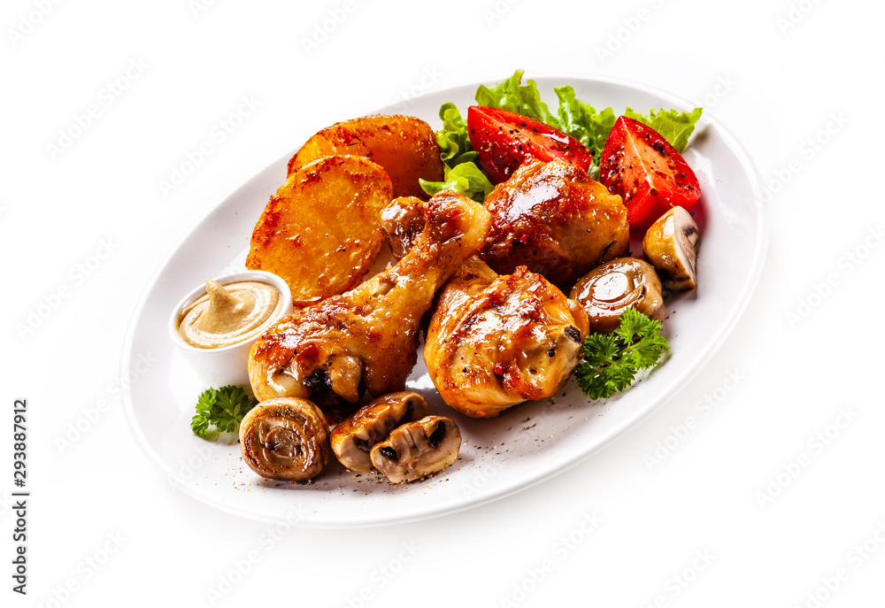 Grilled chicken drumsticks with baked potatoes and vegetables Grilled chicken drumsticks with baked potatoes and vegetables