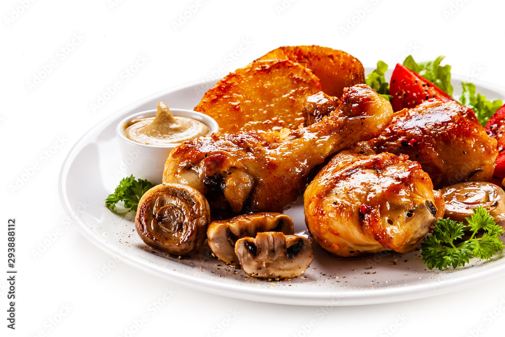 Grilled chicken drumsticks with baked potatoes and vegetables Grilled chicken drumsticks with baked potatoes and vegetables