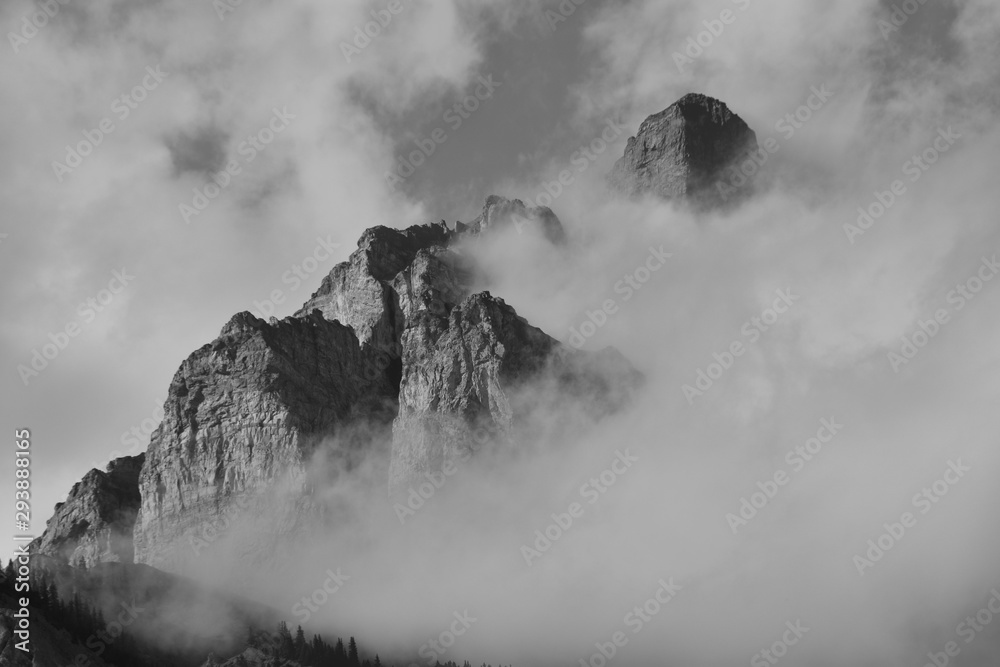  Clouds partially obscuring peak of cascade mountain in Banff national park.