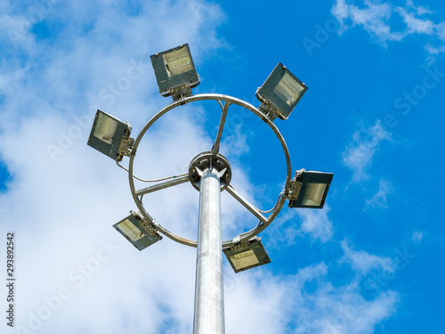 led urban lighting lamp on a pole against the blue sky, eco-friendly energy-saving technology in the urban environment