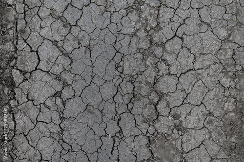 arid land cracked by drought, lack of precipitation and rain © daniiD