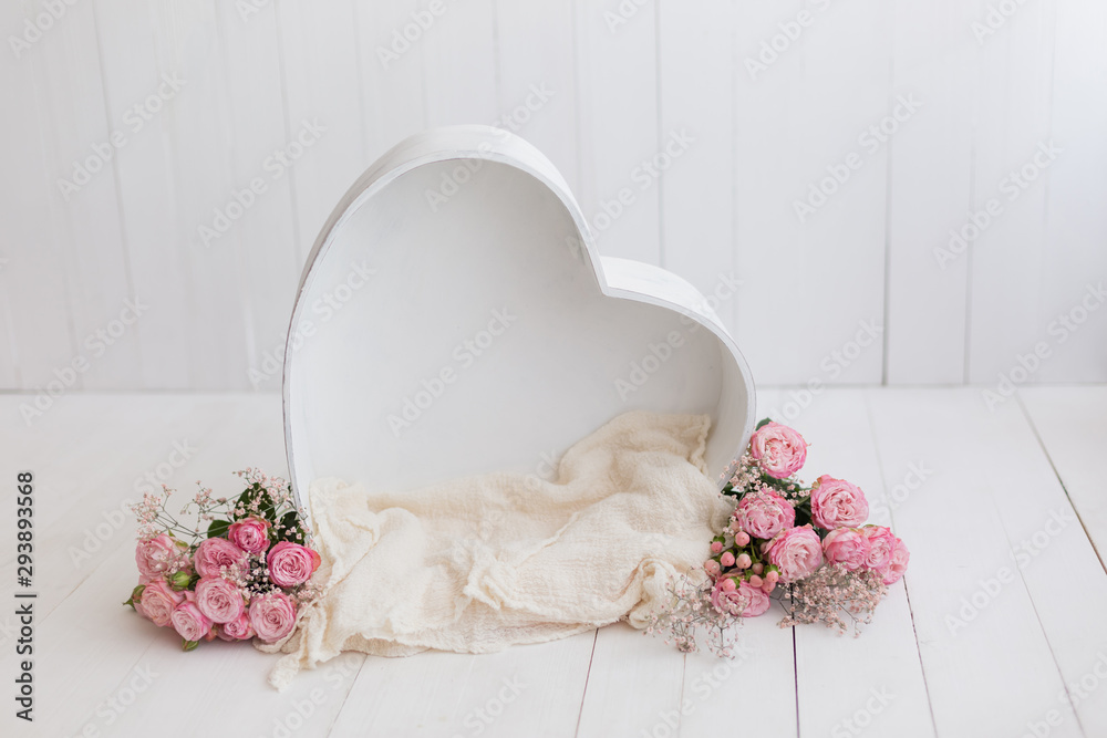 heart of wood decorated with roses. basket for newborn photo shoot. pink rose. heart - obrazy, fototapety, plakaty 