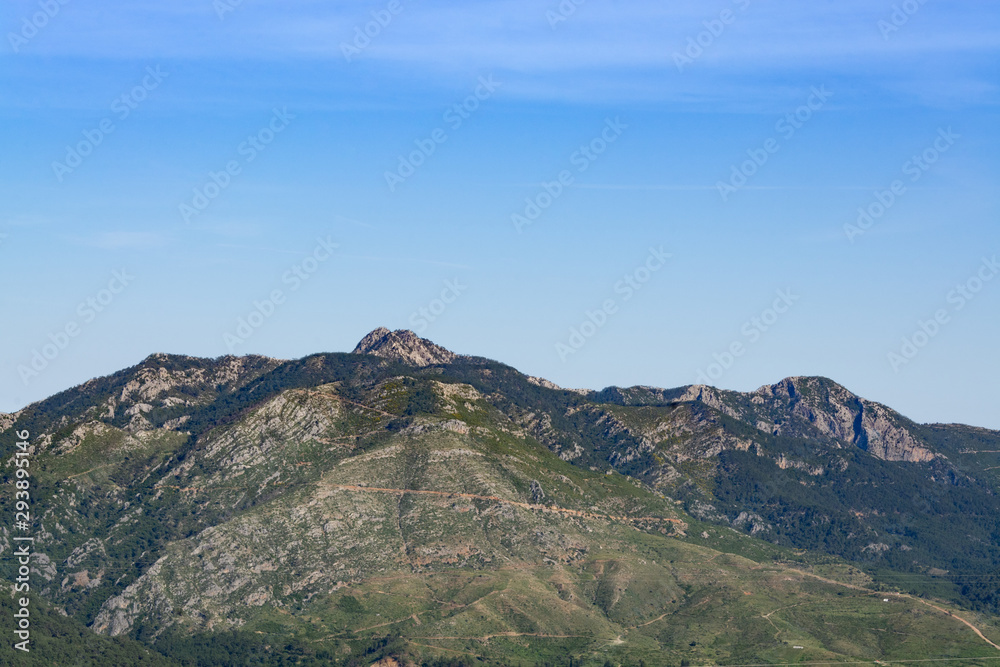 Mountain peaks against the blue sky