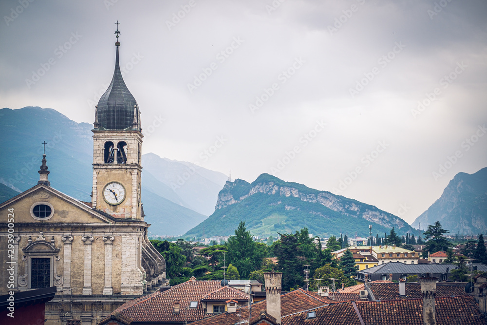 View of church and rooftops in the centre of Arco, Trentino, Italy.