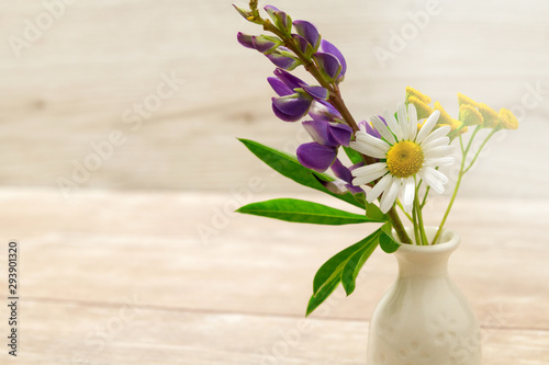 A small vase with flowers. Mother's Day Holidays Concept. Valentine's Day.