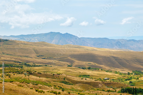 Beautiful summer landscape. Steppe. The mountains. The sky with clouds.