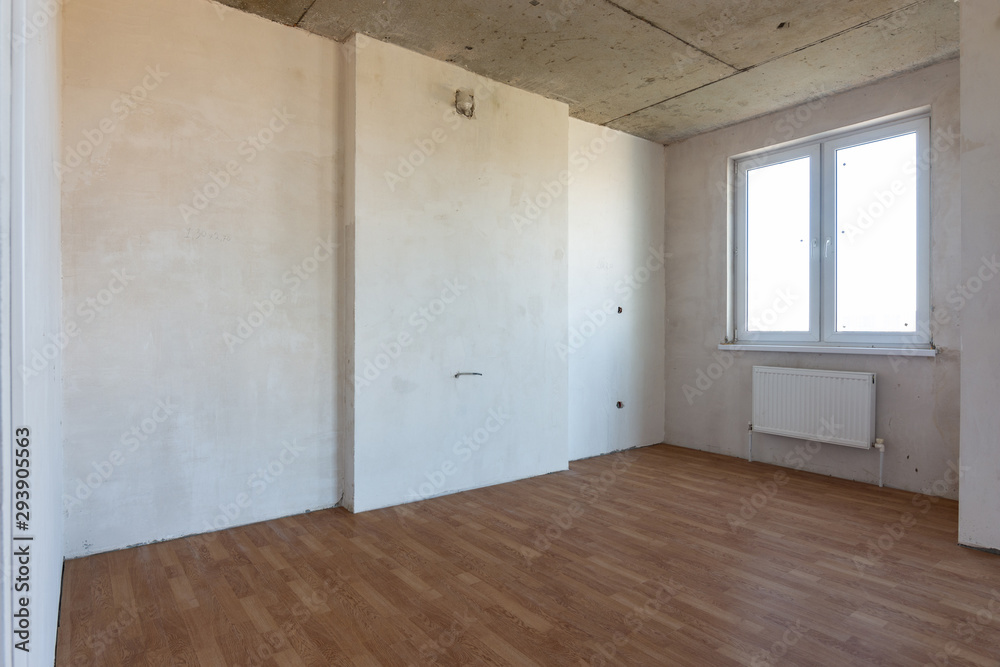 Fragment of an interior in a new building, a room with a fine finish and a window