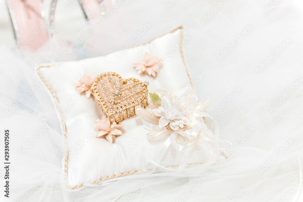 Wedding Arras box on a white pillow Wedding Arras box on a white pillow