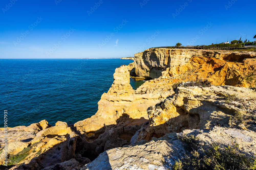 Scenic landscape of the Algar Seco near Carvoeiro with the distinctive limestone pinnacle, Algarve, Portugal