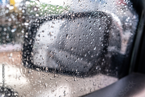 Rainwater is stuck on car clear glass on heavy rain days