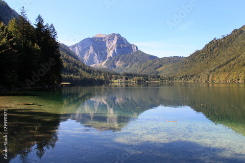 Scenic view of the great landscape reflecting on the shallow crystal clear water of the Vorderer Langbathsee near Ebensee, Oberösterreich, Austria