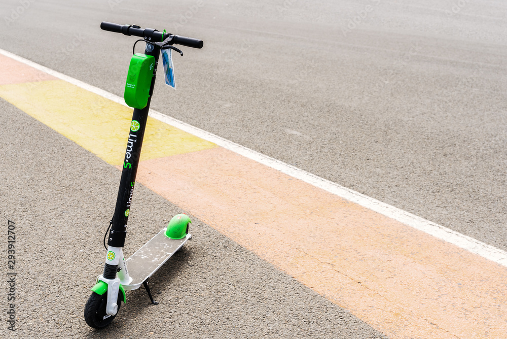 Valencia, Spain - April 29, 2019: Group of electric scooters for rent from  the company Lime, arranged in the most tourist streets of the city. Stock  Photo | Adobe Stock
