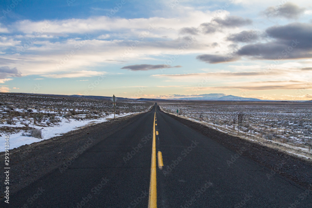 Straight road ahead with vibrant sunset sky Straight road ahead with vibrant sunset sky