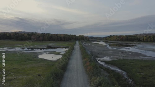 Wallpaper Mural Aerial flight along dirt road crossing dried out lake 4K Torontodigital.ca