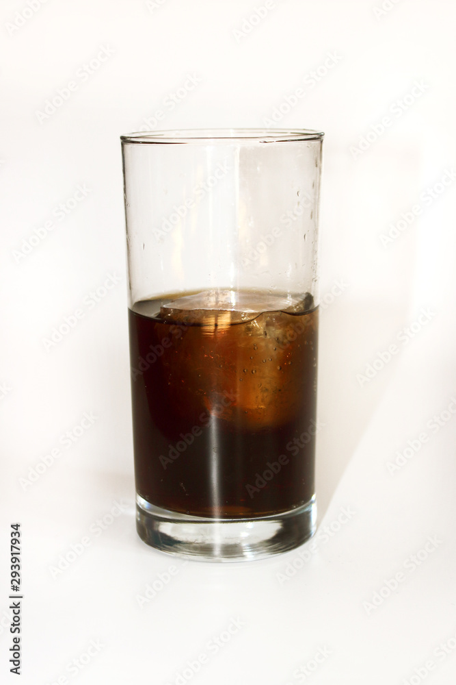 glass of whiskey and cola on white background glass of whiskey and cola on white background
