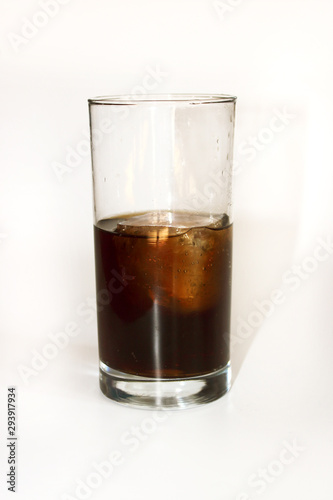glass of whiskey and cola on white background