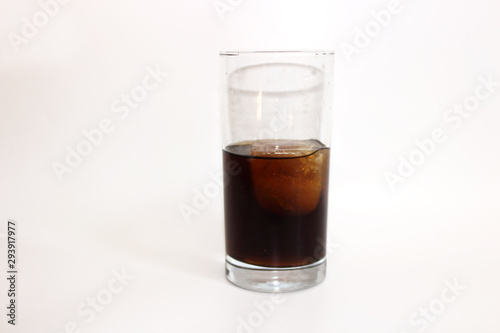 glass of whiskey and cola on white background