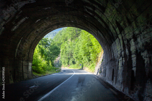 Traffic Tunnel Exit On Beautiful Mountain Road