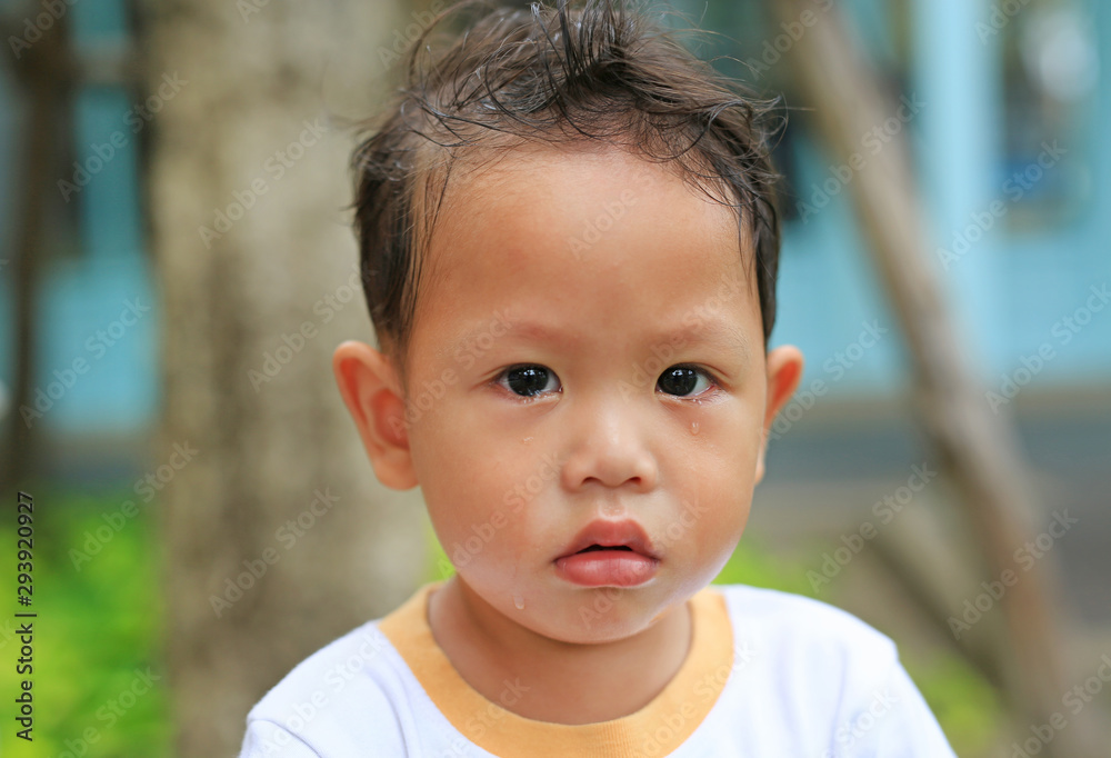 Portrait close-up little baby boy crying and looking at camera. Portrait close-up little baby boy crying and looking at camera.