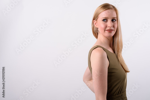 Young beautiful British woman with blond hair against white background