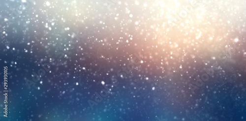 Winter holiday nature abstract background. Fluffy snow blur pattern. Shiny yellow blue defocus silhouette. Dusk sky. Lens flare. Magical outside illustration. New year fantasy decoration.
