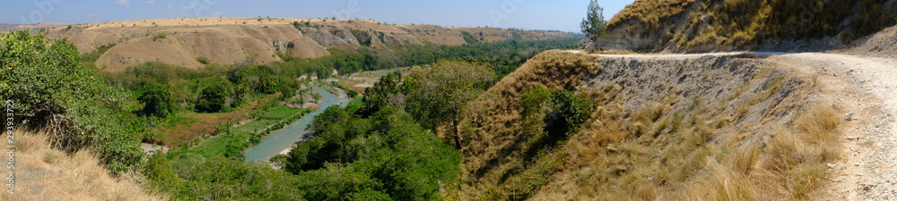 Indonesia Sumba Island landscape view of a local road and the river valley Luku Mondu