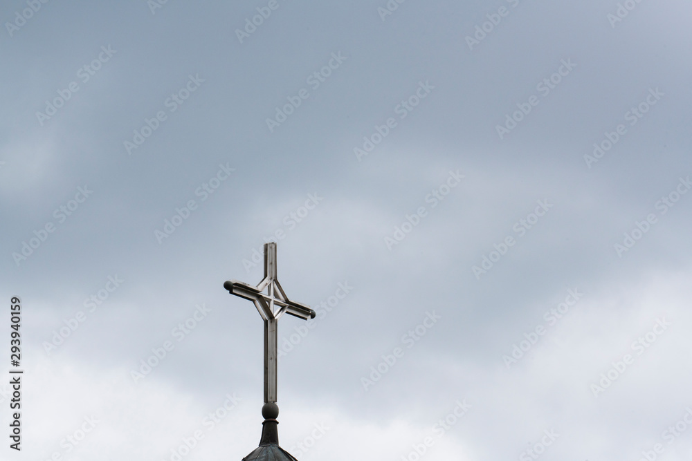 View of Cross sign with cloudy sky background