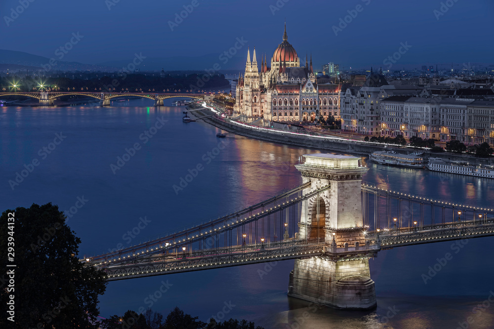 Budapest, Hungary - Aerial skyline view of Budapest with the famous illuminated Szechenyi Chain Bridge and Hungarian Parliament building at dusk